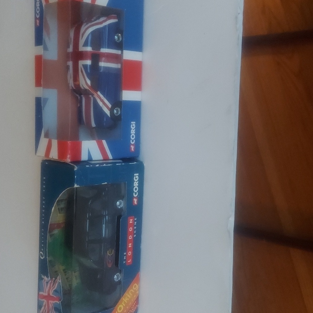Two corgi cars lti London taxi daily  cab.and union jack taxi red white blue new